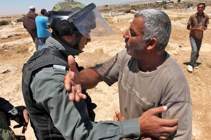 Israeli soldier blocks Palestinian man