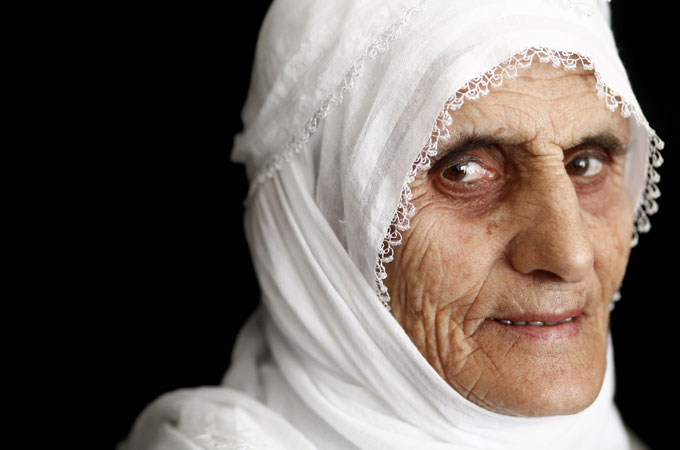 A Kurdish mother tells Al Jazeera she wants her child to return safe after fighting for the PKK [Marielle Van Uitert/Al Jazeera]