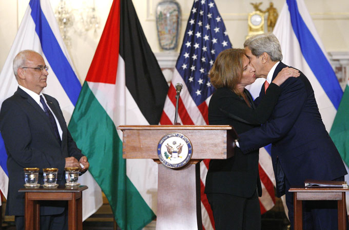 U.S. Secretary of State John Kerry and Israel''s Justice Minister Tzipi Livni embrace after a news conference with Chief Palestinian negotiator Saeb Erekat in Washington