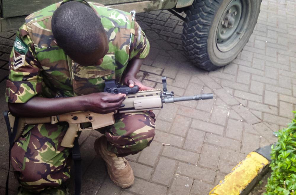 <p>A soldier prepares his kit before an assault on Al Shabab militants by the Kenyan military. The attackers from the Somalia-based group had barricaded themselves in a shopping centre and were suspected to have explosives.</p>