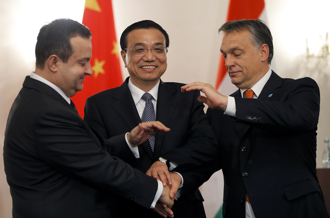China's Li Keqiang shakes hands with Hungary's Viktor Orban and Serbia's Ivica Dacic in Bucharest [EPA]
