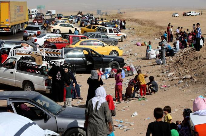 Thousands of Iraqis fleeing areas controlled by the Islamic State have been stranded at checkpoints [AP]