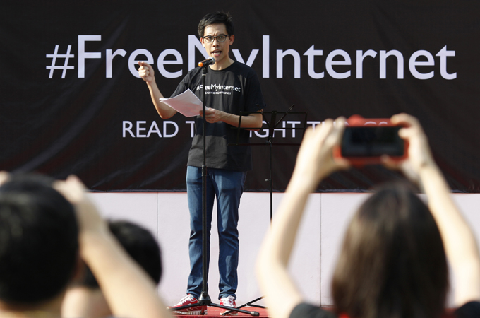 Roy Ngerng of online blog The Heart Truths addresses a crowd during a June protest [Reuters]