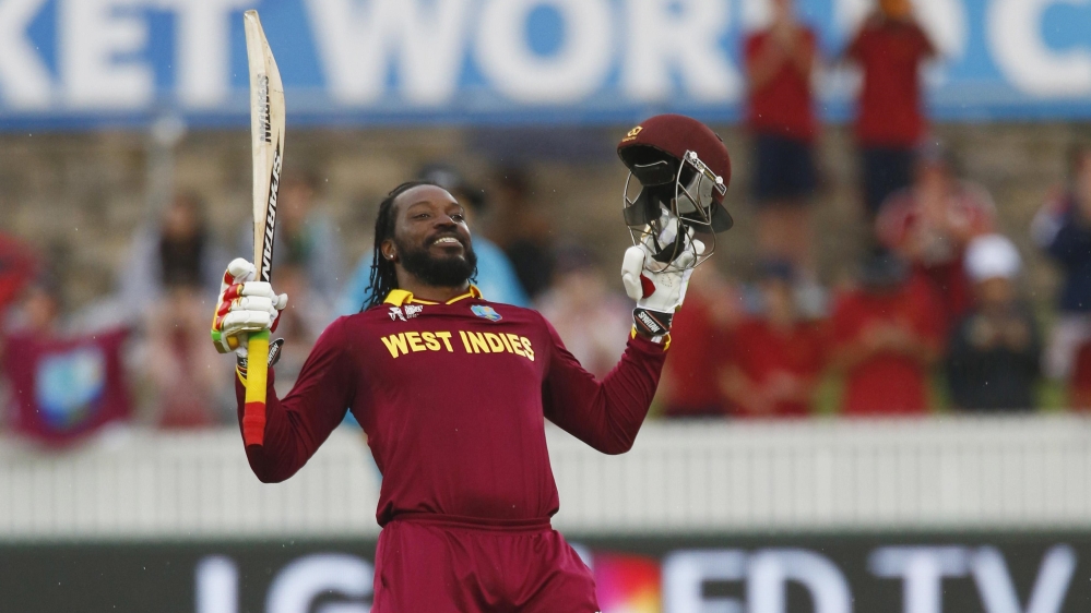 West Indies batsman Chris Gayle celebrates scoring 200 runs, a double century, during their World Cup Cricket match against Zimbabwe in Canberra