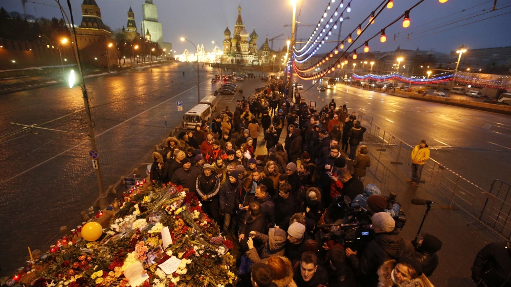 People gather at the site where Boris Nemtsov was recently murdered, in central Moscow