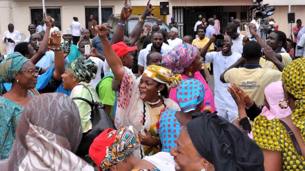 Supporters of Buhari celebrate the election results in Abuja