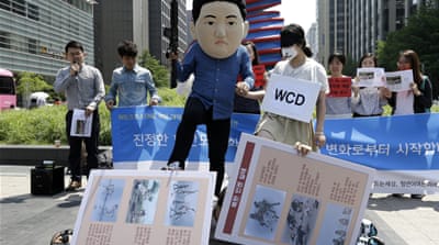 South Korean university students gathered to oppose the women's march from North Korea to South Korea across the demilitarised zone [AP]