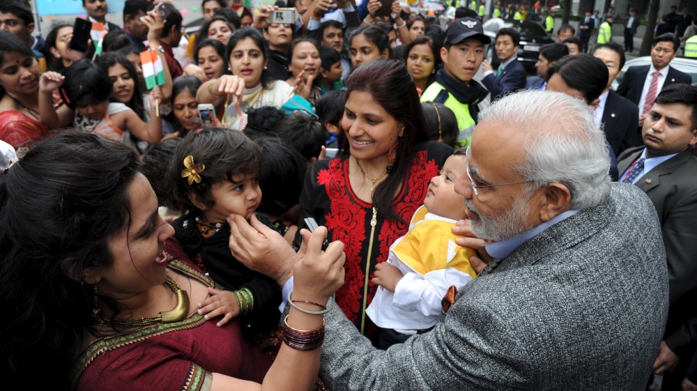 Indian Prime Minister Narendra Modi greets Indian people in central Seoul, South Korea [Reuters]
