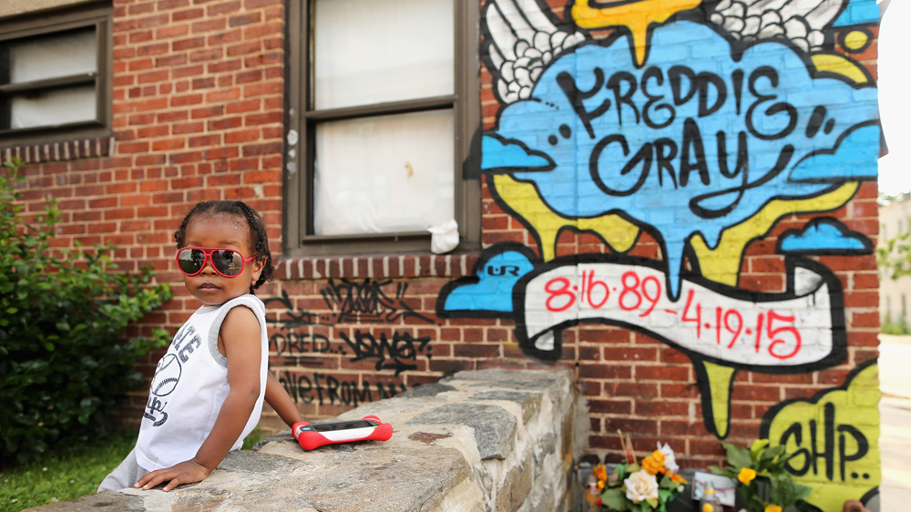 A mural memorialising Freddie 'Pepper' Gray is painted on the wall above the place where he was tackled and arrested by police [Getty Images]