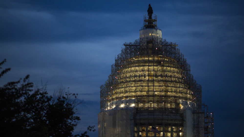 The US Capitol is illuminated at dusk in Washington, DC [Getty]