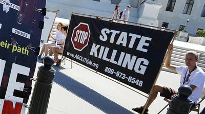 Anti-death penalty demonstrators gather in front of the US Supreme Court building in 2015
