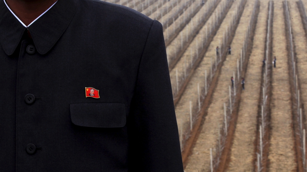 File photo of an official of Daedonggang Fruit Farm posing on the outskirts of Pyongyang
