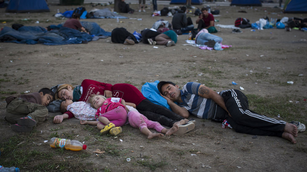 Syrian refugees in Belgrade, Serbia, are waiting for an opportunity to travel north to cross the border with Hungary, entering the EU [AP]
