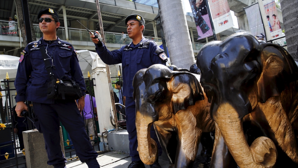 Thai police stand guard at Erawan Shrine, the site of the recent bomb blast, in Bangkok