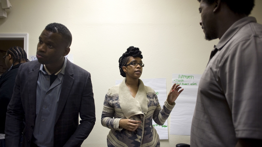 'People see black people as a threat, and that's a problem,' says community activist Kim Moore, reflecting on the persistence of racism [David Maung/Al Jazeera]