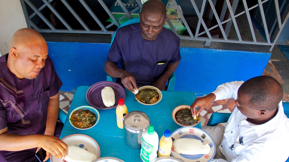 Appetite Delight is busiest at lunchtime. The first two weeks of the month are normally the more profitable for Golda because, she says, most of her patrons are salaried workers given the high population of civil servants in the city [Femke van Zeijil/Al Jazeera]