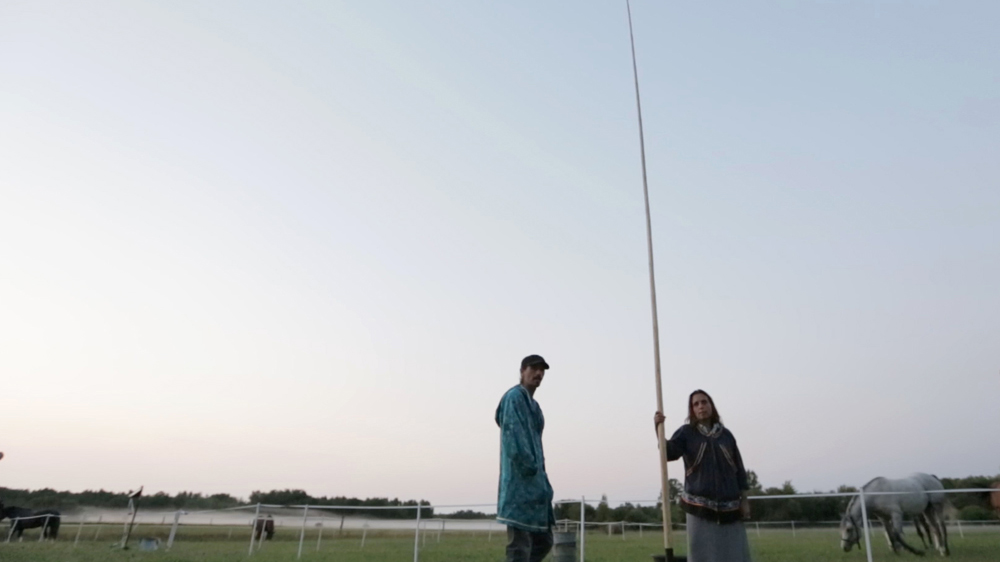Winona LaDuke of Honor the Earth holds a wild ricing pole used for propelling the boat used to harvest the rice, a traditional staple for many of Minnesota's indigenous tribes [Blackbeard Films]