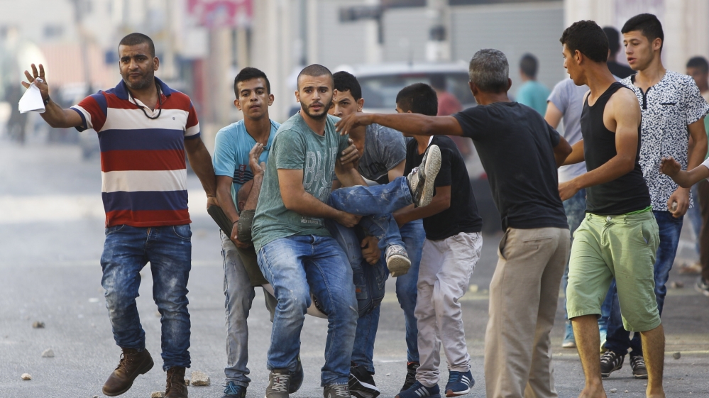 
Palestinian Red Crescent accused Israeli forces of using live ammunition and rubber-coated steel bullets against Palestinian protesters [AP]
