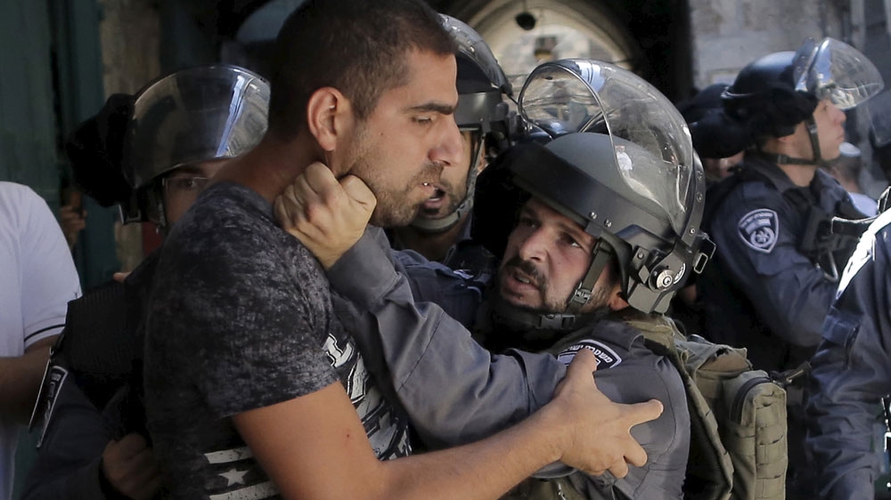  An Israeli policeman prevents a Palestinian man from entering the compound which houses al-Aqsa Mosque [Ammar Awad/Reuters] Palestinian protesters throw stones during clashes in the West Bank city of Bethlehem [Abed Al Hashlamoun/EPA] A Palestinian man prays as Israeli policemen stand nearby during Friday prayers outside Jerusalem's Old City near the Arab East Jerusalem neighbourhood of Wadi al-Joz [Ammar Awad/Reuters] 