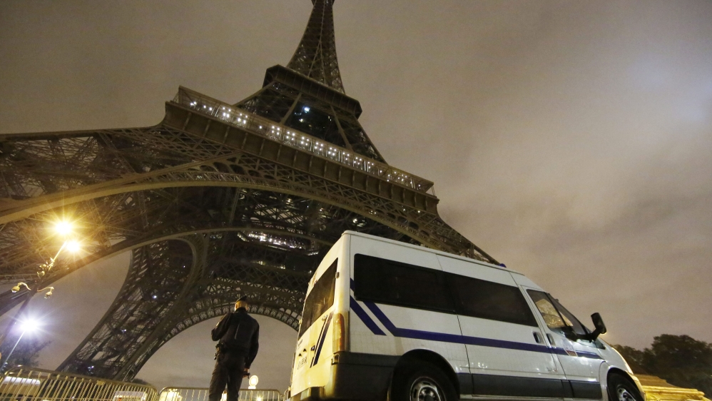 A police officers stands guard at the foot of the Eiffel Tower in Paris, France [EPA]