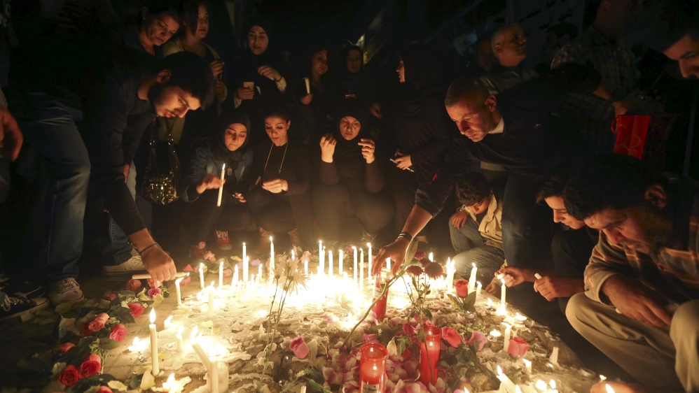 Please don''t use - People light candles during a vigil at the site of the two explosions that occurred on Thursday in the southern suburbs of the Lebanese capital Beirut