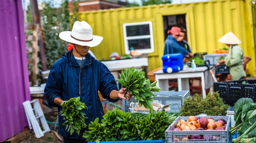 Hsar Lar Doe manages a farm in Cleveland. The nine people who work there come from five different countries [Angelo Merendino/Al Jazeera]