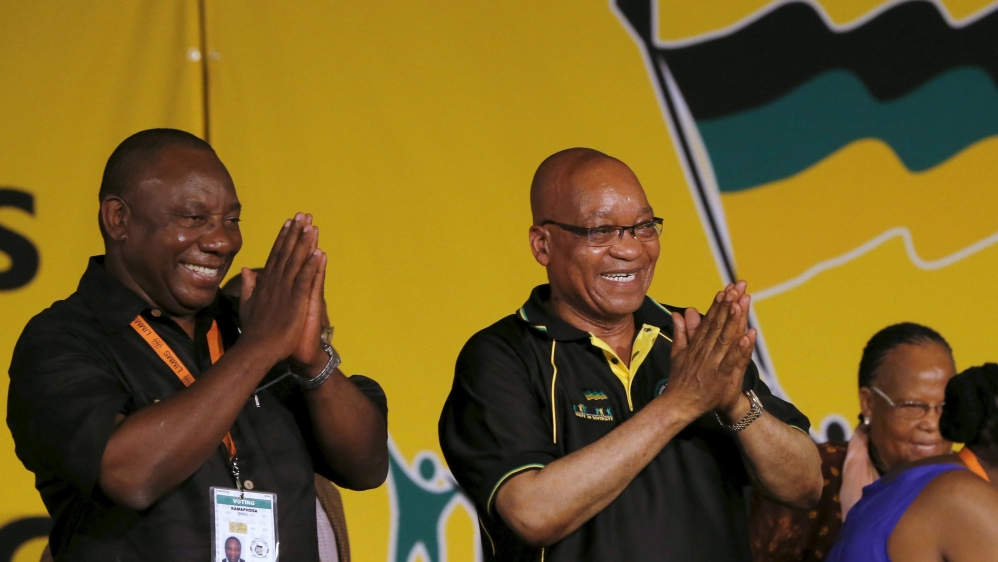 File photo of South Africa''s President Jacob Zuma celebrating his re-election as party President alongside his deputy Cyril Ramaphosa at the National Conference of the ruling African National Congress