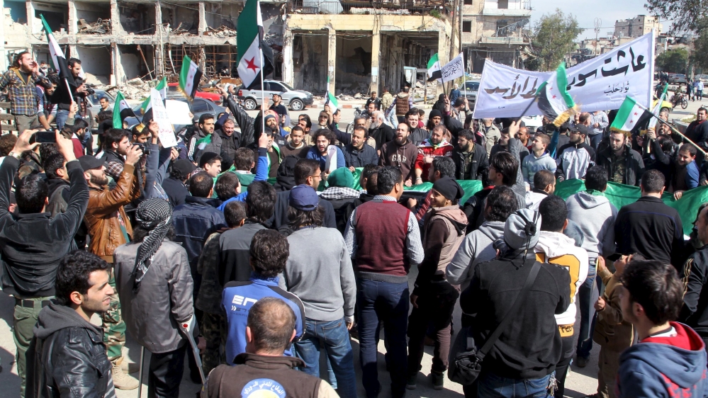 People attend an anti government protest in Bab al-Hadid district of Aleppo