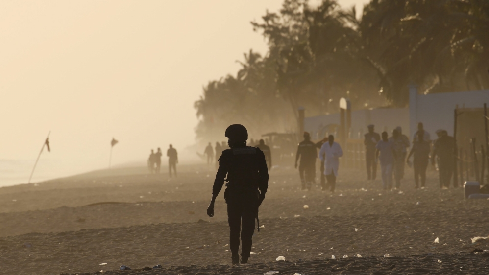 A security officer walks on the beach after an attack in Grand Bassam, Ivory Coast [REUTERS]