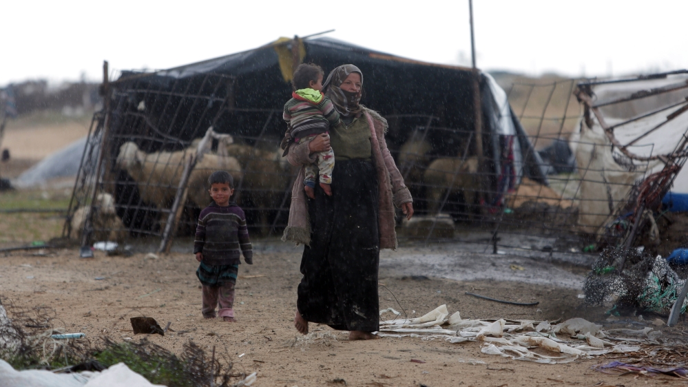 A Palestinian Bedouin mother and her children