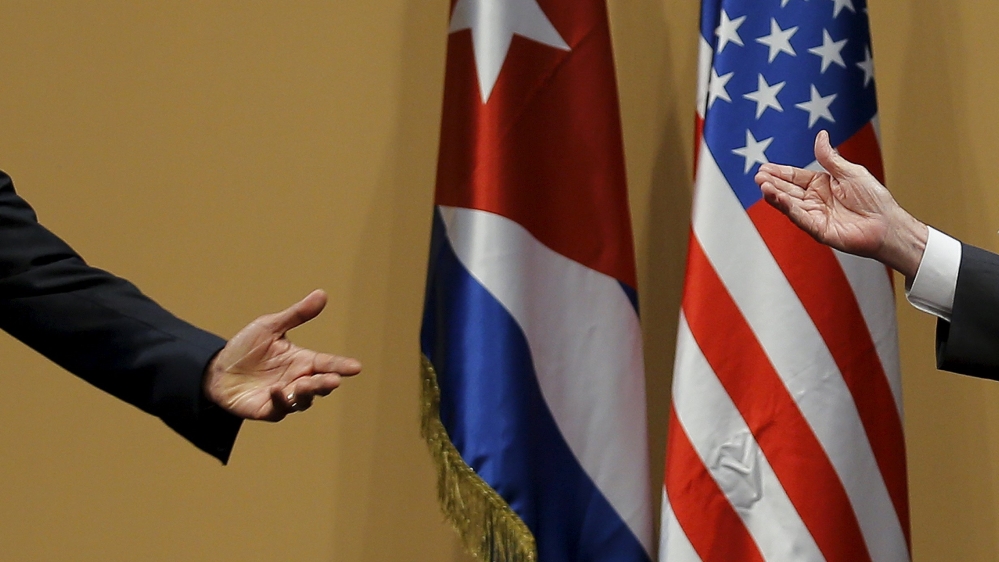 The hands of U.S. President Barack Obama and Cuban President Raul Castro are seen during a news conference as part of Obama''s three-day visit to Cuba, in Havana