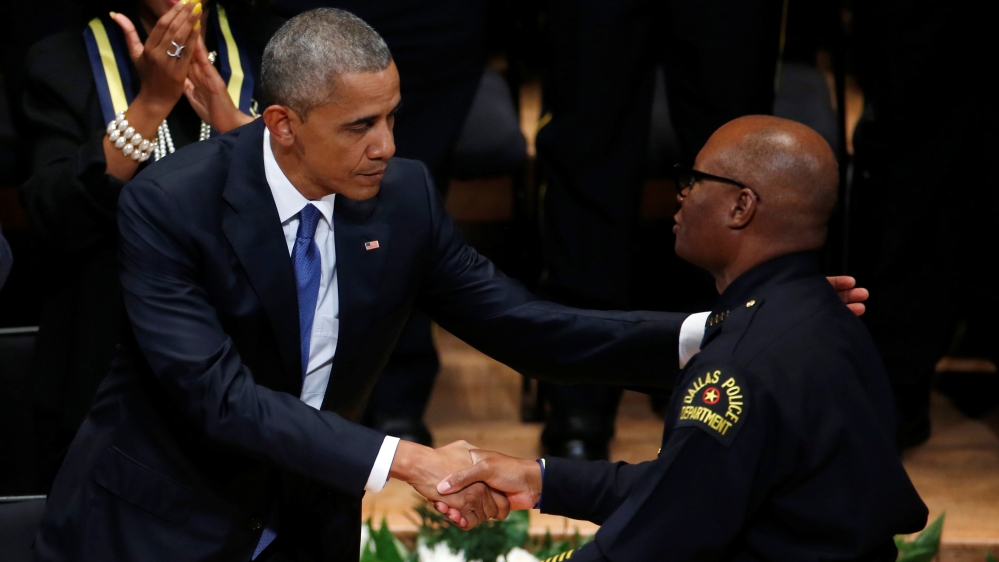 U.S. President Barack Obama shakes hands with Dallas police chief David Brown during a memorial service following the multiple police shootings in Dallas