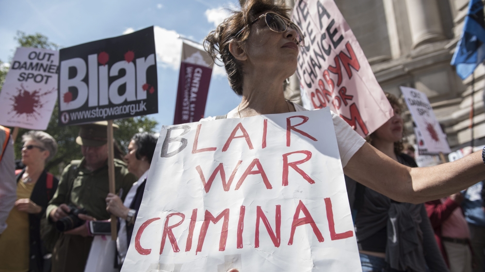 Protesters hold a demonstration as they wait for the release of the Chilcot Inquiry in London, Britain [EPA]