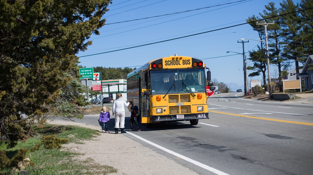 Tiffany picks Sofiya up from the side of the busy highway that runs alongside the motel. She takes the bus to and from school [Carolyn Bick/Al Jazeera]
