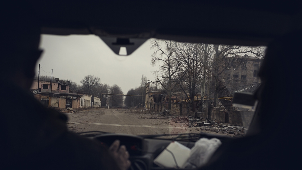 Destroyed buildings near the airport in December 2014. School No 58 lies two or three kilometres away from this area [Kyrre Lien/Al Jazeera]