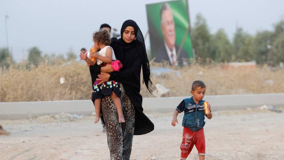 Displaced Iraqis, who had fled to Syria to escape the violence in Mosul, arrive in Kirkuk [REUTERS]