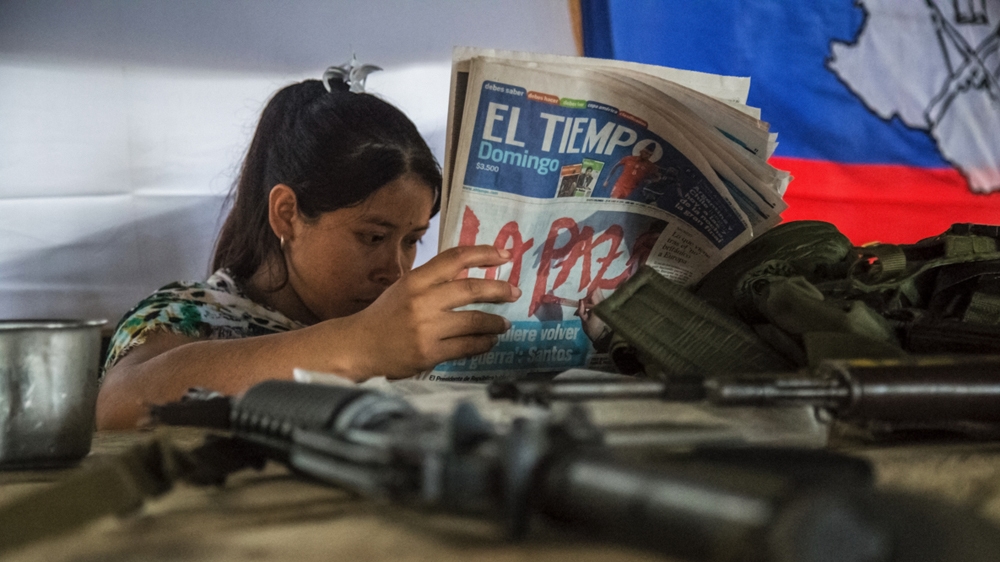 Yoli contemplates the opposition to the peace accords [Tomas Ayuso/Al Jazeera] 