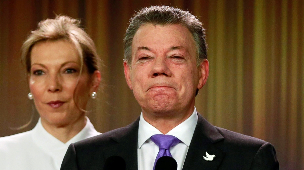 Santos addresses the media next to his wife after winning the Nobel Peace Prize, at Narino Palace in Bogota, Colombia [REUTERS]