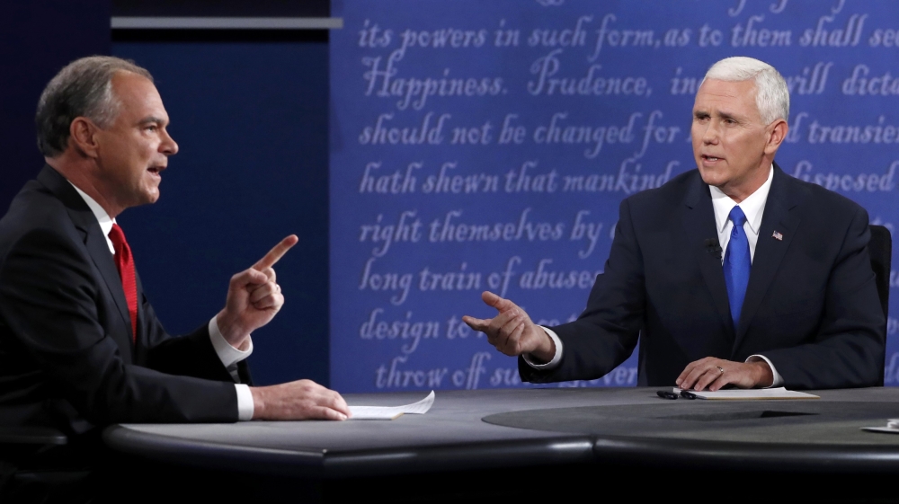 Democratic US vice presidential nominee Tim Kaine (L) and Republican vice presidential nominee Mike Pence during their debate at Longwood University in Farmville, Virginia, October 4, 2016.