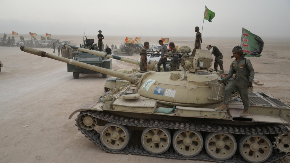 Iraqi security forces and Iraqi pro-government forces take part in an operation against Islamic State militants at the al-Shura area, south of Mosul