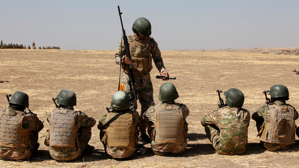 Fighters from predominantly Sunni Arab forces take part in a training session before the upcoming battle to recapture Mosul in Bashiqa