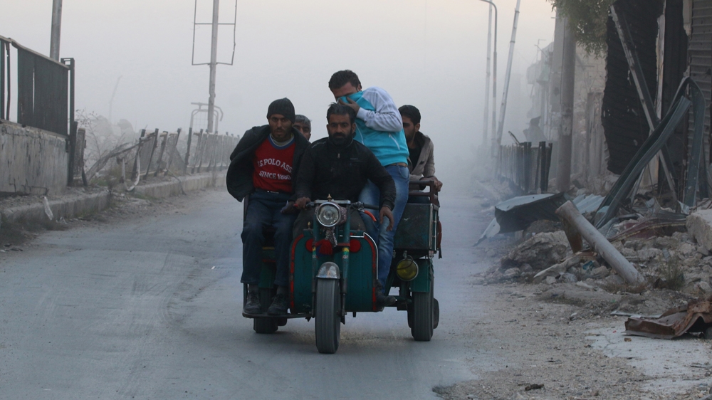 DATE IMPORTED:26 November, 2016Men ride on a vehicle amidst dust after a strike on the rebel held besieged al-Shaar neighbourhood of Aleppo, Syria, November 26, 2016. REUTERS/Abdalrhman Ismail