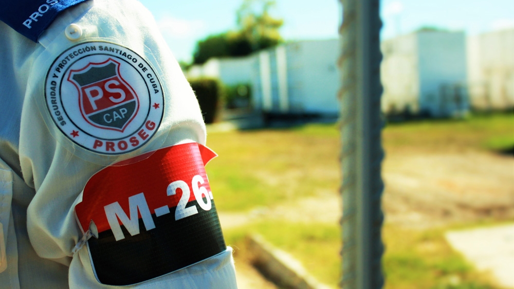 State workers wear armbands commemorating the 26th of July Movement that was led by Fidel Castro [Al Jazeera] 