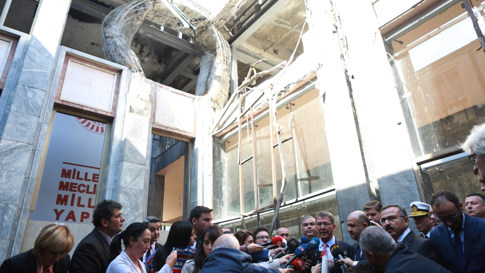 
US Defence Secretary Ash Carter, with Turkey's Defence Minister Fikri Isik, in October visited the Turkish parliament, which was partly damaged in the coup attempt [Adem Altan/Reuters]
