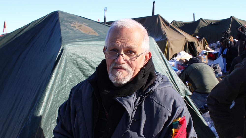 Albert Strickland, 70, a Vietnam veteran from Savannah, Georgia, spent weeks at the camp. 'I grew up in the cowboy era. But I never rooted for the cowboys to win. I always thought … maybe this time,' he said [Adam Levinson/Al Jazeera] 