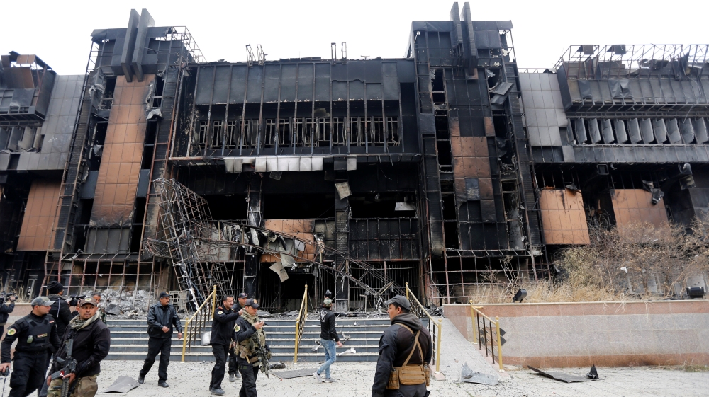 Iraqi Special Operations Forces (ISOF) gather near a building of the University of Mosul during a battle with Islamic State militants, in Mosul