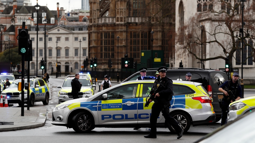 Armed police respond outside Parliament during an incident on Westminster Bridge in London