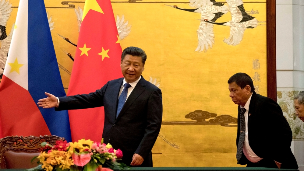File photo of Philippine President Rodrigo Duterte shown the way by Chinese President Xi Jinping before a signing ceremony held in Beijing
