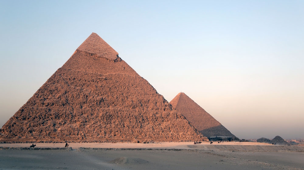 The Great Pyramid of Giza, on the left, is the last of the Seven Wonders of the Ancient World still in existence [Dorian Geiger/Al Jazeera]