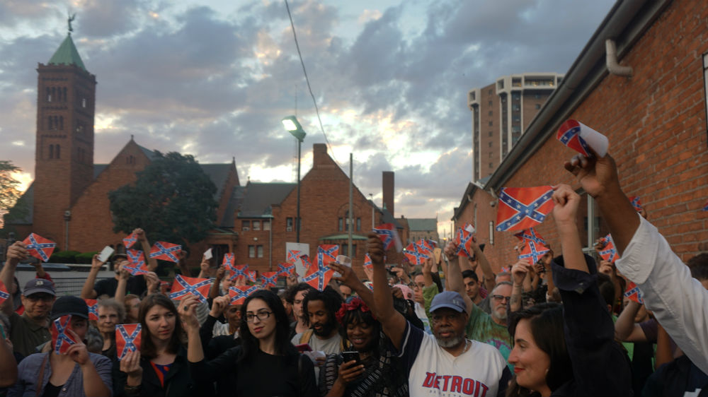 More than 70 people attended the Confederate flag burning held at the N’Namdi Center for Contemporary Art in Detroit on Memorial Day [Kurt Nagl/Al Jazeera]